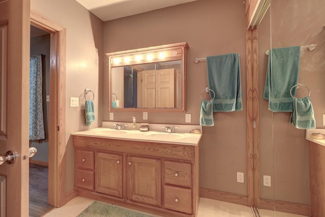 full bath featuring double vanity and a sink