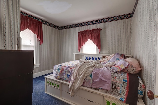 bedroom with carpet, baseboards, and wallpapered walls