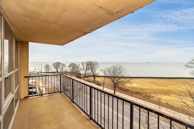 balcony featuring a water view