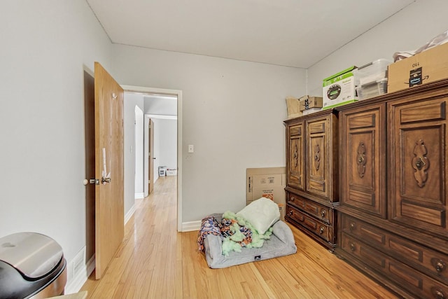 interior space featuring light wood-style floors and baseboards