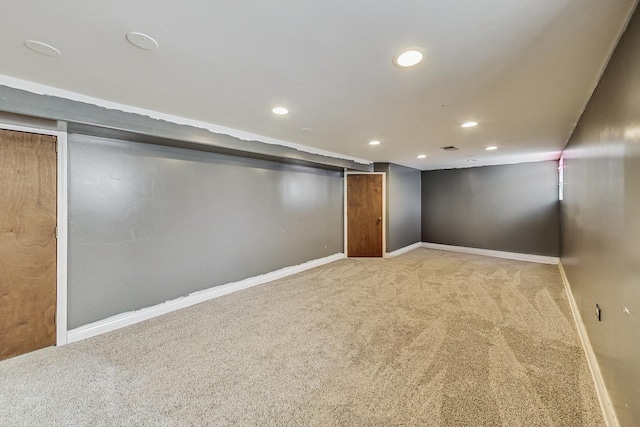 finished basement featuring recessed lighting, carpet flooring, visible vents, and baseboards