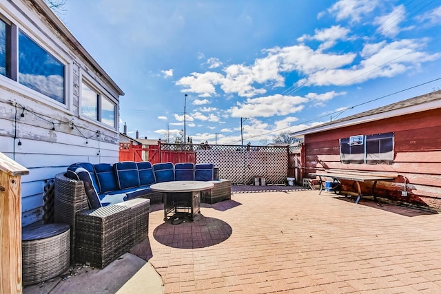 wooden deck with a patio area and fence