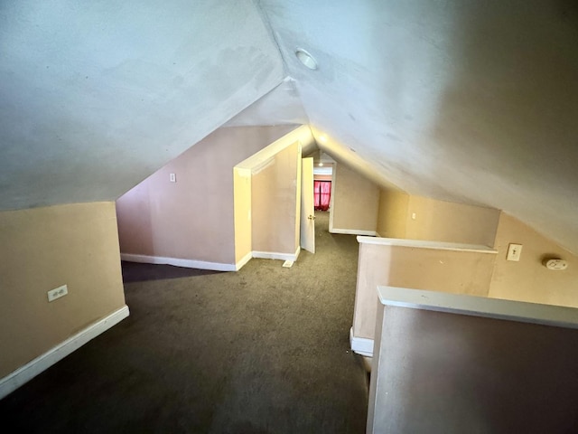 bonus room featuring lofted ceiling, baseboards, and carpet flooring