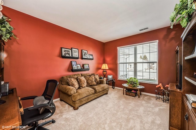 office with visible vents, baseboards, and carpet