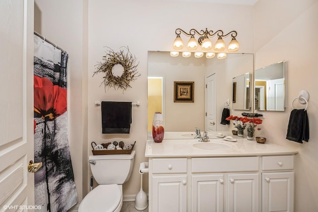 full bath featuring toilet and vanity