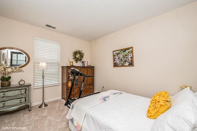 bedroom with carpet flooring, baseboards, and visible vents