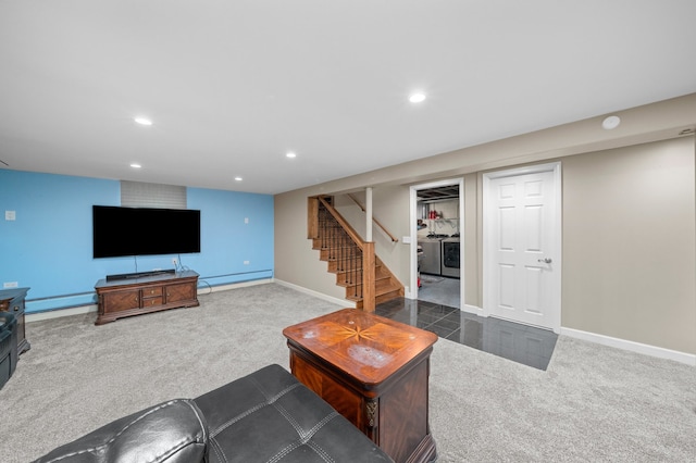 carpeted living area with separate washer and dryer, stairway, baseboard heating, and recessed lighting