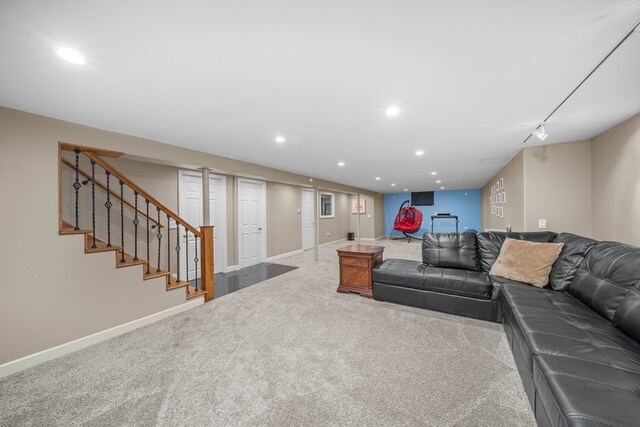 carpeted living area with recessed lighting, baseboards, and stairs