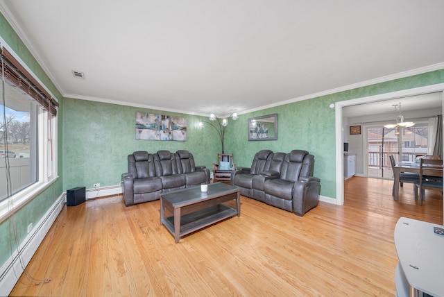 living area featuring a baseboard heating unit, visible vents, crown molding, and wood finished floors