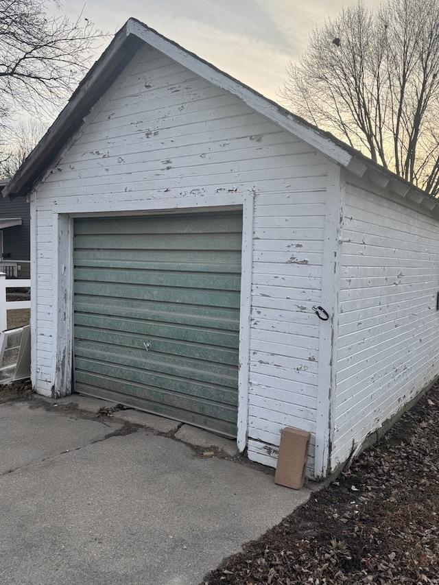 detached garage featuring driveway