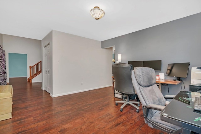 home office featuring baseboards and wood finished floors