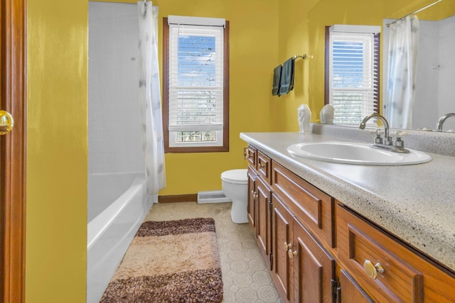 bathroom with visible vents, toilet, vanity, tile patterned flooring, and baseboards