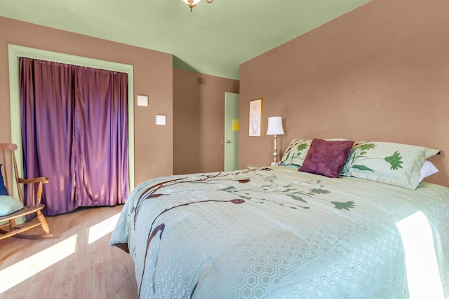 bedroom featuring wood finished floors