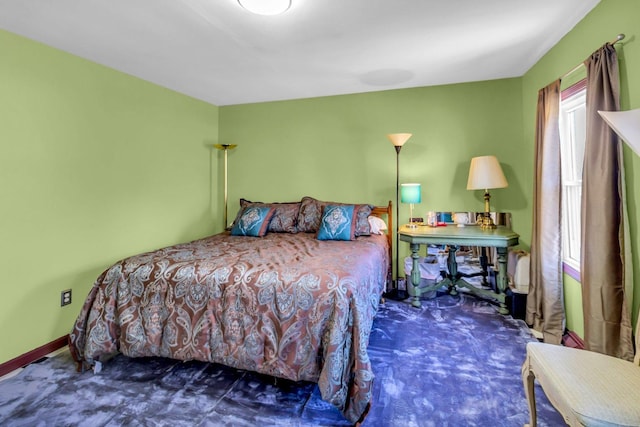 bedroom with multiple windows, carpet, and baseboards