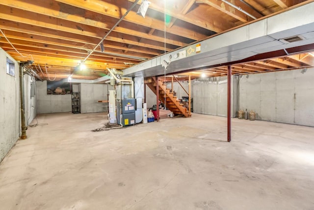 unfinished basement featuring heating unit