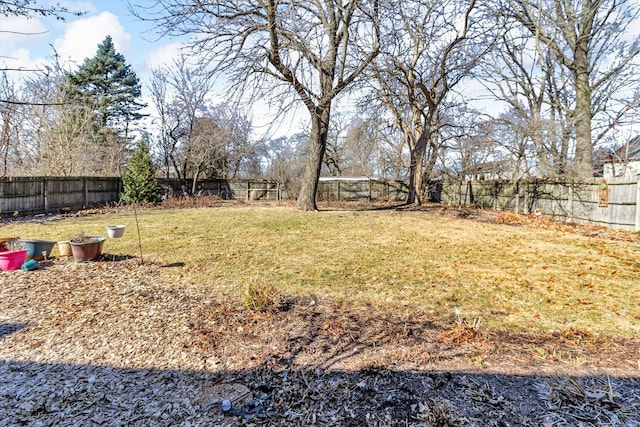 view of yard with a fenced backyard