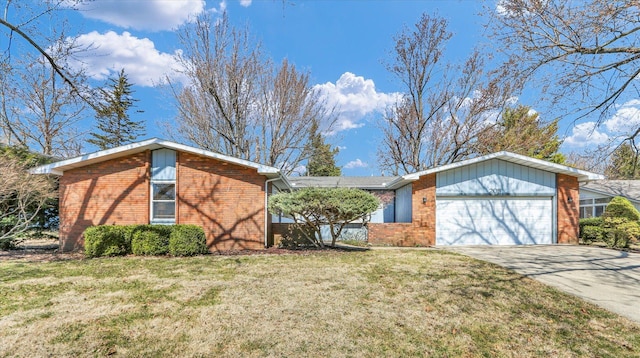 mid-century modern home featuring concrete driveway, an attached garage, brick siding, and a front lawn