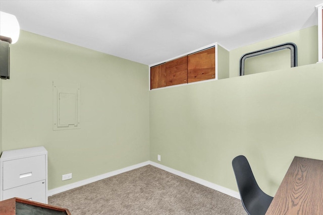 unfurnished office featuring carpet flooring and baseboards