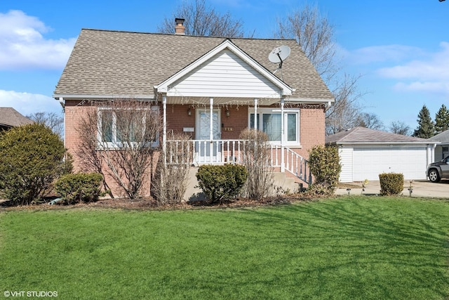 bungalow-style home with a front lawn, a porch, a shingled roof, brick siding, and a chimney