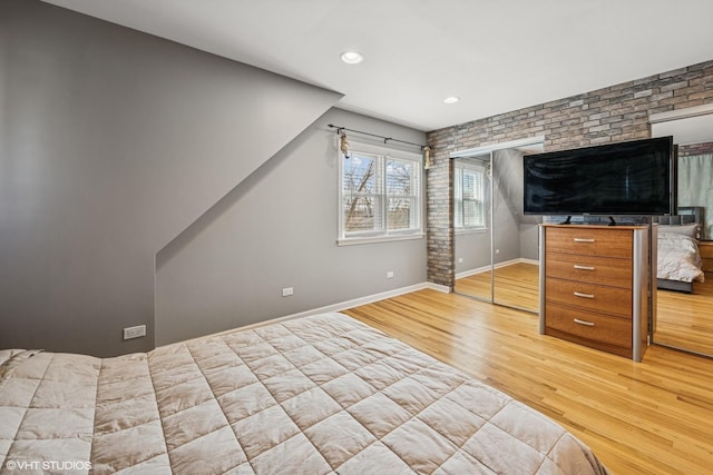 unfurnished bedroom featuring recessed lighting, baseboards, and wood finished floors