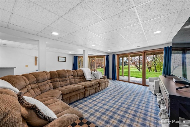 carpeted living room with recessed lighting and a drop ceiling