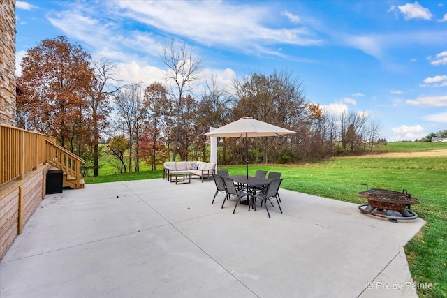 view of patio featuring an outdoor living space with a fire pit