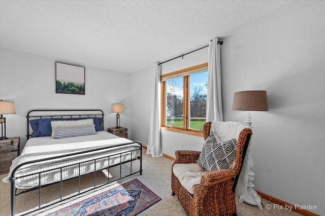 bedroom featuring baseboards and a textured ceiling