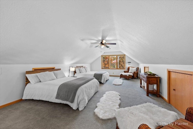 carpeted bedroom with ceiling fan, a textured ceiling, baseboards, and vaulted ceiling