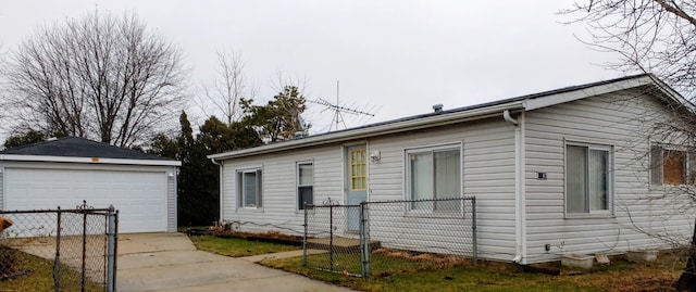 view of home's exterior featuring a garage, an outdoor structure, and fence