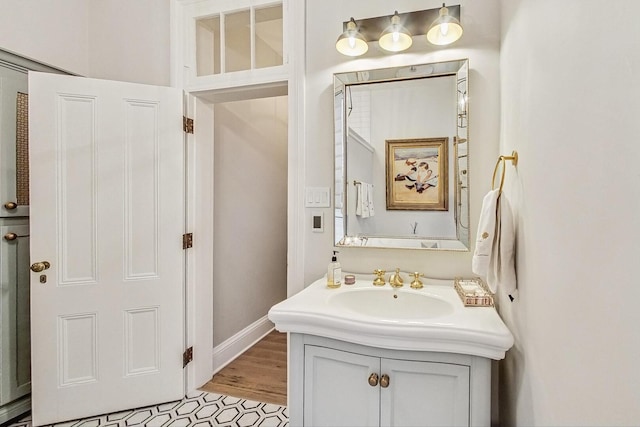 bathroom with vanity and baseboards