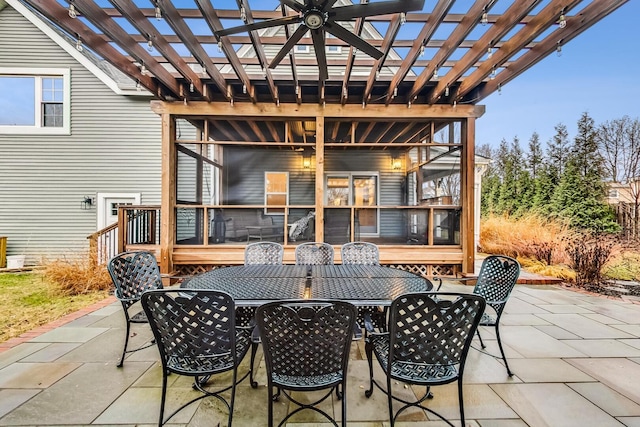 view of patio featuring outdoor dining area and a pergola