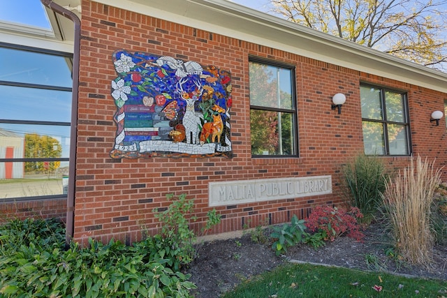 view of side of property with brick siding