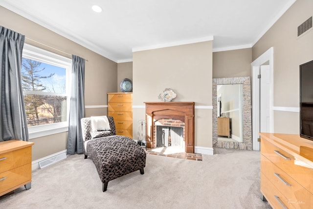 living area with carpet floors, a brick fireplace, and visible vents