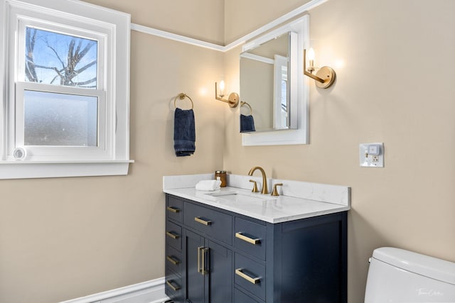 half bathroom featuring toilet and vanity