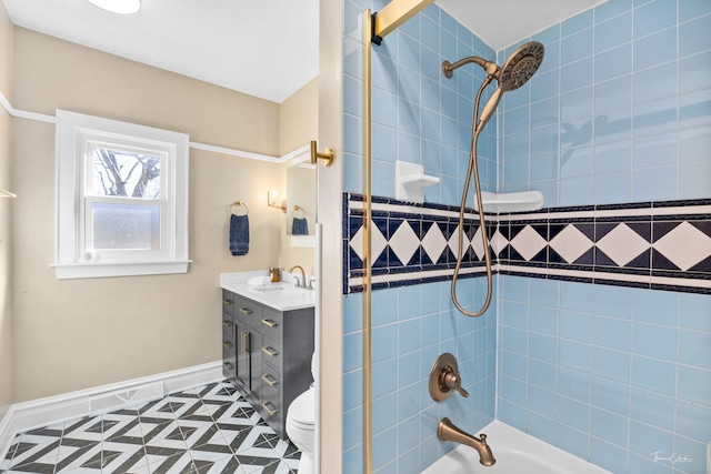 bathroom with shower / bath combination, baseboards, toilet, and vanity