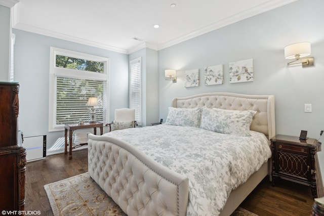 bedroom with visible vents, ornamental molding, dark wood finished floors, and baseboards