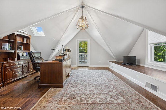 office area with vaulted ceiling with skylight, visible vents, baseboards, dark wood finished floors, and an inviting chandelier