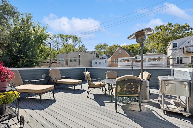 wooden deck featuring a residential view