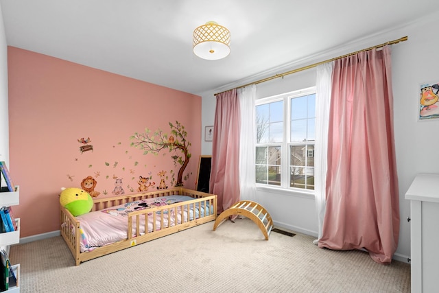 bedroom featuring carpet flooring, visible vents, and baseboards