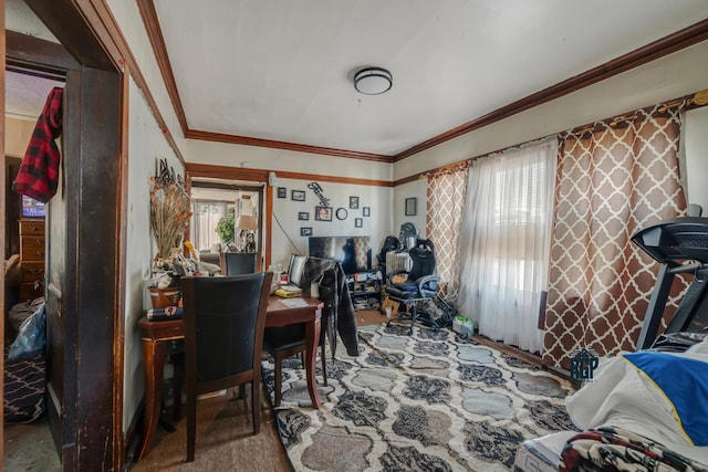 carpeted dining space featuring ornamental molding