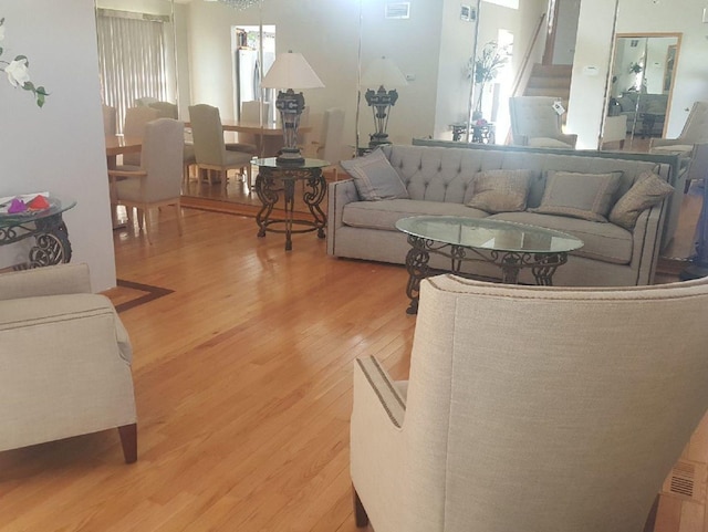 living room featuring stairs and wood finished floors