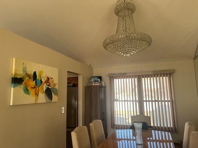 dining space featuring an inviting chandelier