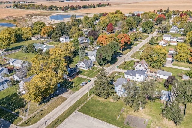 birds eye view of property with a water view and a residential view