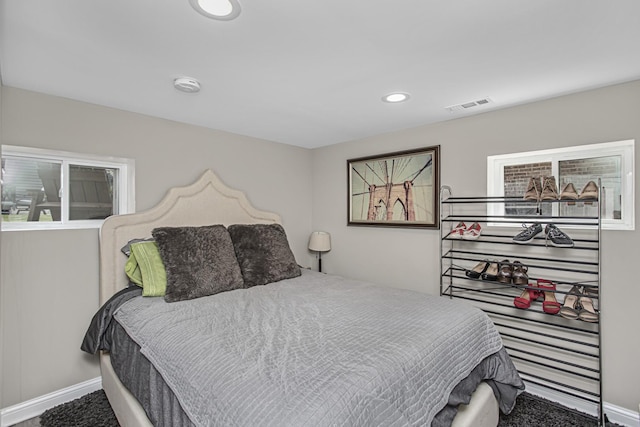 bedroom featuring carpet floors, baseboards, visible vents, and recessed lighting