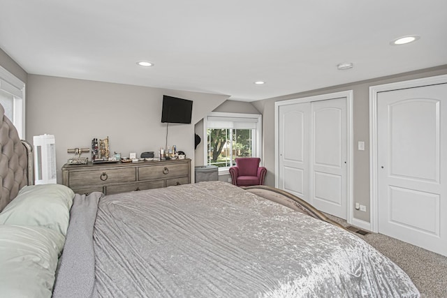 carpeted bedroom featuring visible vents, baseboards, and recessed lighting