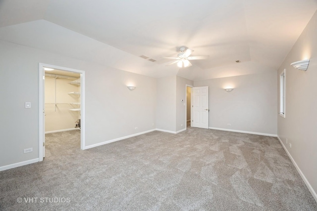 empty room with visible vents, ceiling fan, carpet, and baseboards