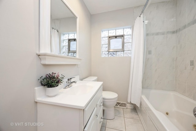 bathroom featuring visible vents, toilet, shower / tub combo with curtain, vanity, and tile patterned floors