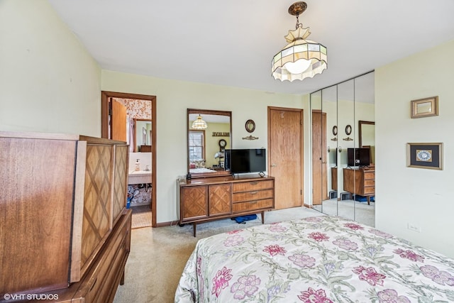 bedroom featuring carpet and two closets