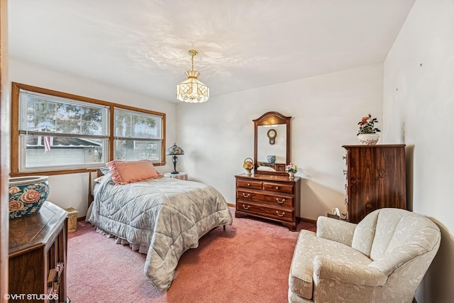 bedroom with baseboards and carpet flooring