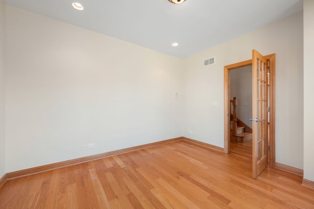 spare room with baseboards, recessed lighting, visible vents, and light wood-style floors